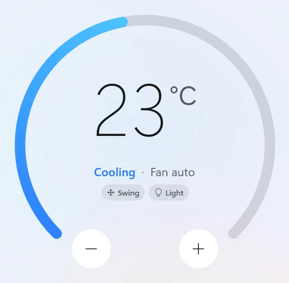 Close-up of the dial at 23 °C, Cooling, Fan auto, with Swing and Light tags and the − and + buttons.
